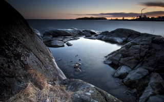 Dusk ocean rocks grass city - a sky line free wallpaper