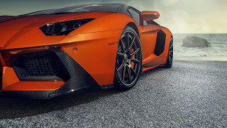 Orange sports car ocean cloudy - nice free wallpaper