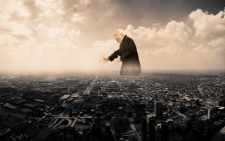 Flying man city sky clouds - over a city free wallpaper