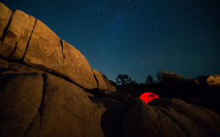Tent rocky outcropping night sky - astrophotography free wallpaper