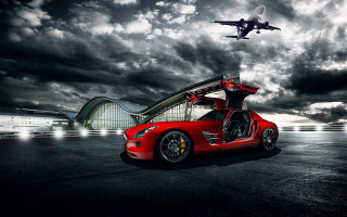 Red sportscar jet plane cloudy - overhead in the sky above free wallpaper