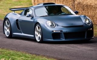 Blue sports car driving road 5 - a blue sports car free wallpaper