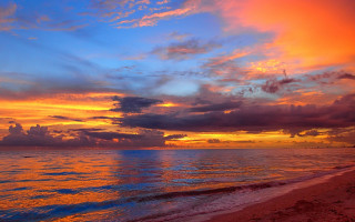 Sunset ocean clouds beach boat - colorful cloud free wallpaper