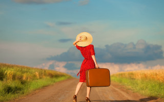 Woman red dress hat suitcase - liminal free wallpaper