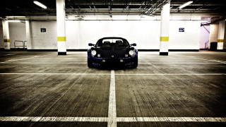 Parking garage car symmetry tiltshift - a yellow stripe free wallpaper