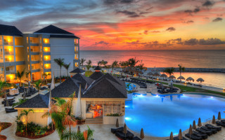 Resort pool sunset ocean beach - vibrant colour free wallpaper