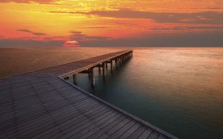 Pier sunset ocean clouds mountain - a long pier free wallpaper