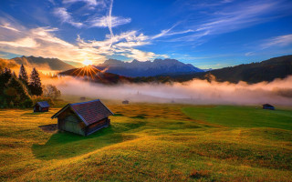 Romantic mountain field sunset horizon - a sun setting behind free wallpaper