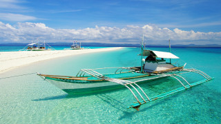 Beach boat ocean clouds saturated - top of a beach next free wallpaper