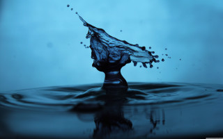 Water droplet blue background splashing - this image free wallpaper for desktop