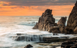 Rocky beach waterfall sunset cloudy - a rocky beach free wallpaper for desktop