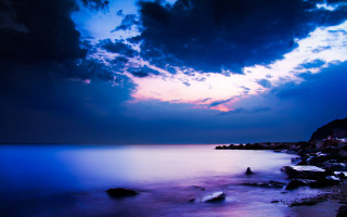 Mystical ocean shore rocks clouds - rock free wallpaper