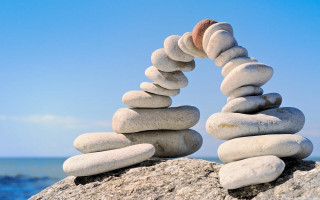 Stack rocks ocean blue sky - a stack of rocks free wallpaper