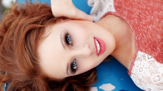 Aramenta redhaired blueeyes laying blurry - a blue surface free wallpaper