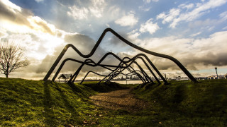 Metal sculpture grassy field cloudy - sculpture free wallpaper