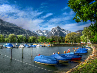 Boats water mountain range snow - the water near a mountain range free wallpaper