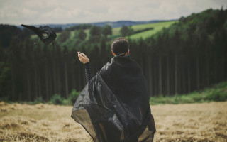 Woman black cape flying bird - a black cape free wallpaper