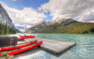 Dock red canoes lake mountains - lake free wallpaper