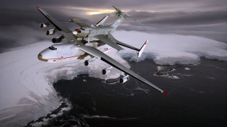 Large plane flying over ocean - epic scale free wallpaper