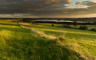 Grassy field river clouds evening - crepuscular ray free wallpaper