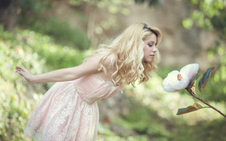 Woman pink dress holding flower - pastel color free wallpaper