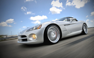 Silver sports car cloudy sky 3 - a road under a cloudy sky free wallpaper