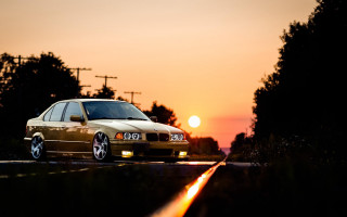 Car sunset forest road flame - golden hour free wallpaper