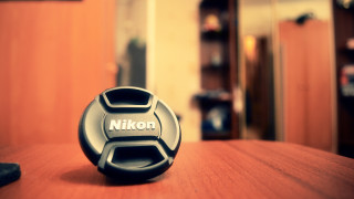 Nikon lenscap table mirror remote - a table in a room free wallpaper