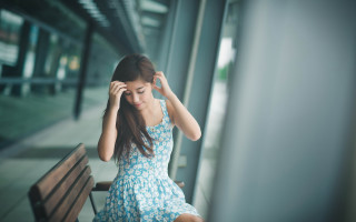 Woman sitting blurry blue dress - a bench free wallpaper