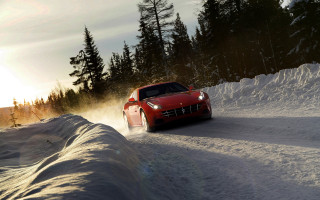 Red sports car snowy road 2 - a snow free wallpaper for desktop