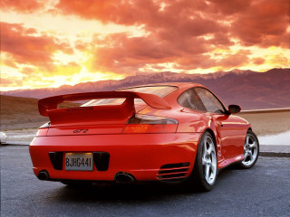 Red sports car sunset clouds 3 - a parking lot free wallpaper