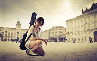 Woman kneeling guitar case backpack 2 - anka zhuravleva free wallpaper