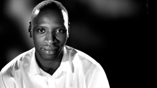 Serious man white shirt bald - bruce onobrakpeya free wallpaper