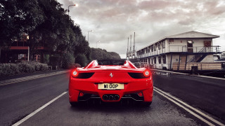 Red sports car cityscape cloudy - a building and trees free wallpaper