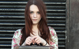 Woman purse metal door shutters - a woman holding free wallpaper