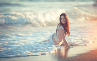 Beach woman smiling laying water - portrait photography free wallpaper