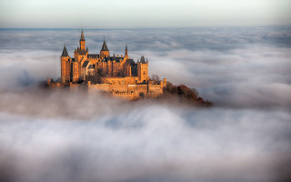 Castle foggy sky trees mountains - free architecture wallpaper
