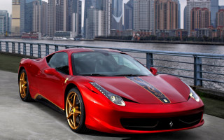 Red sports car cityscape river - a city skyline free wallpaper