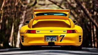 Yellow sports car parked street - a number plate free wallpaper