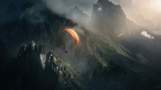 Paraglider mountain range cloudy sky - over a mountain range in the sky free wallpaper