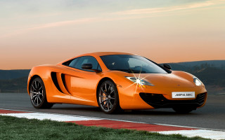 Bright orange sports car sunset 3 - andrew allan free wallpaper