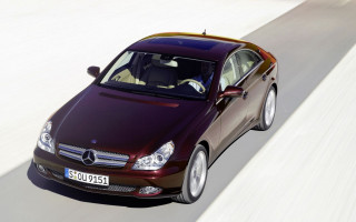 Maroon car driving white wall - a white wall behind free wallpaper