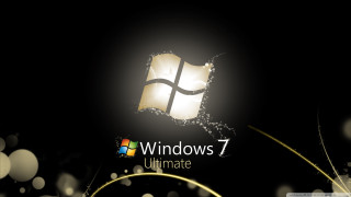 Black background windows7 logo gold - a window 7 logo free wallpaper