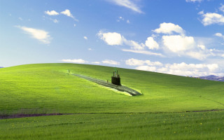 Green field small tower blue - surrealism free wallpaper