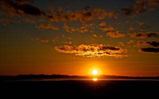 Sunset clouds boat water island - free sunset wallpaper