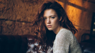 Woman long hair couch brick - a couch in a room free wallpaper