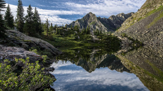 Mountain lake reflections trees clouds - a mountain lake free wallpaper