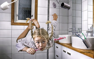Little girl upside down bathroom - down free wallpaper