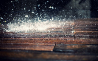Wooden table snowing cityscape night - a tilt shift photo free wallpaper