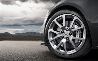 Car wheel mountains clouds clock - a dark sky free wallpaper